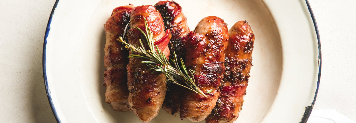 Pigs in Blankets Recipe - Gozney . Roccbox recipe poster image