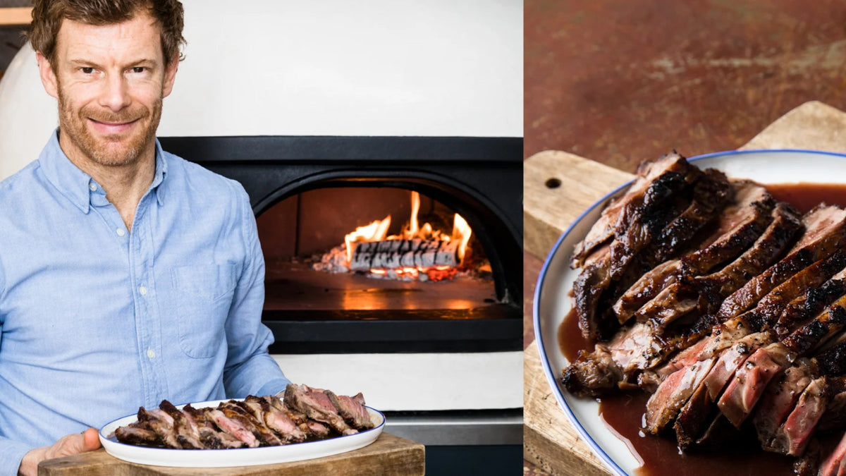 Tom Aikens’ next to his Butterflied Leg of Lamb in Red Wine recipe poster image