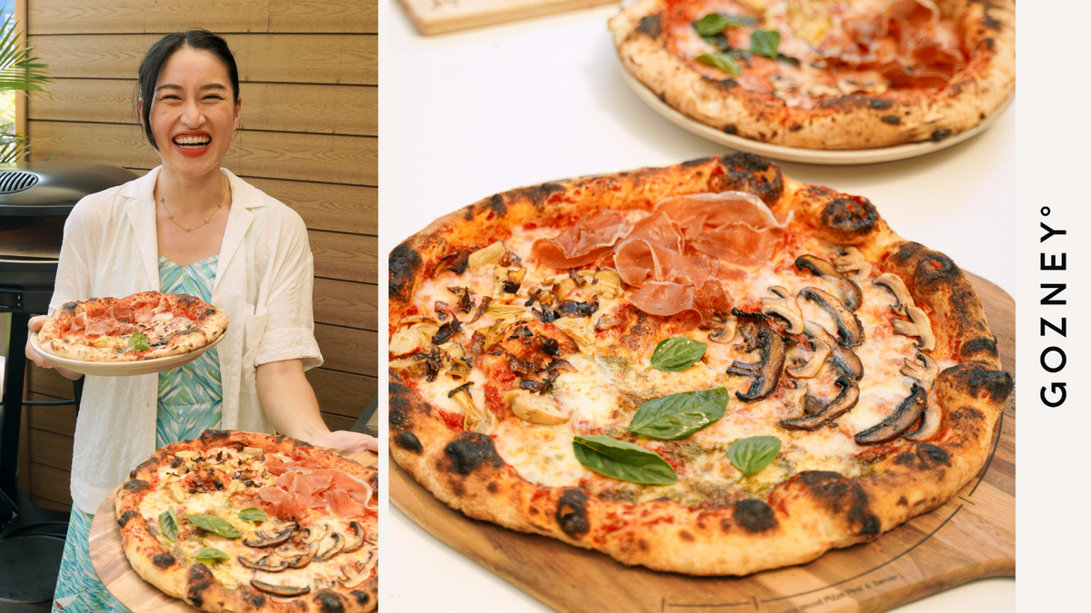 Chef Feng holding her Four Seasons pizza
