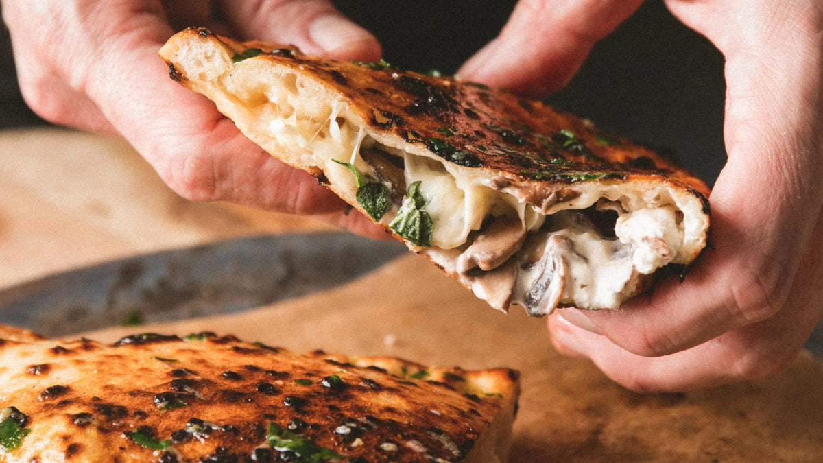 Mushroom and ricotta calzone with garlic butter recipe poster image