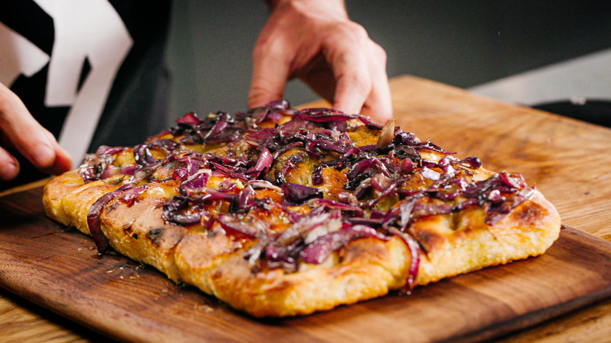 Onion Focaccia Cut into 4 slices recipe poster image
